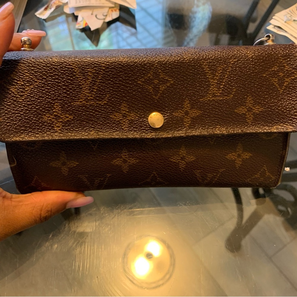 Authentic LV wallet. Noticeable wear and tear but still fully functional .
